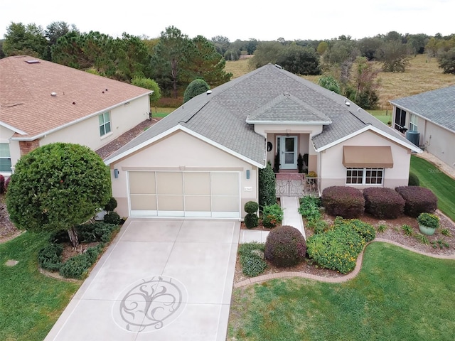 view of front facade with a garage and a front yard