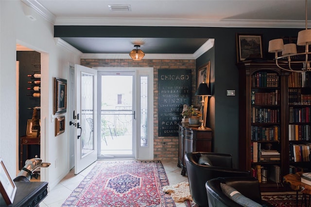 tiled foyer entrance with crown molding