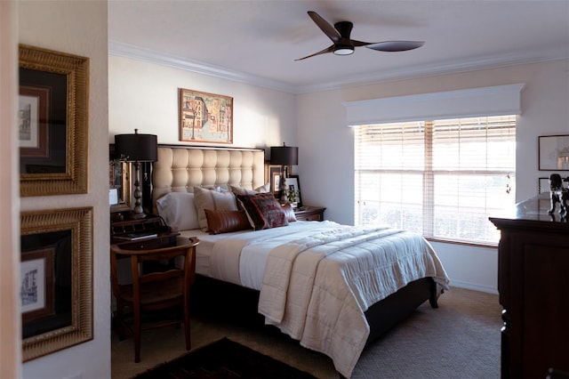 carpeted bedroom featuring crown molding and ceiling fan