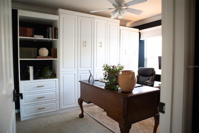 office space featuring crown molding, light colored carpet, and ceiling fan