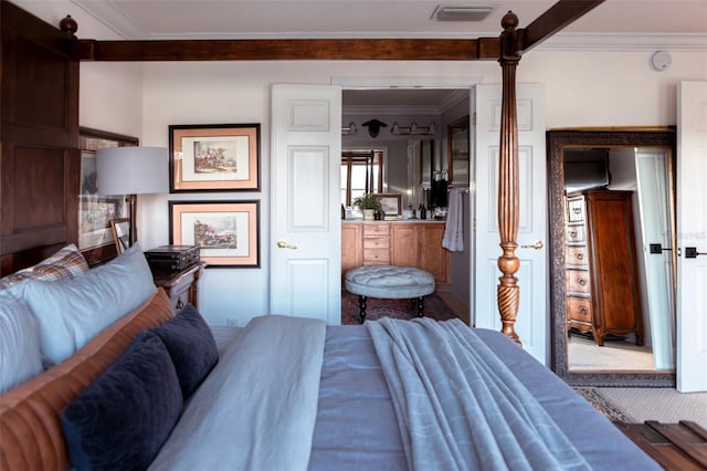 carpeted bedroom with crown molding