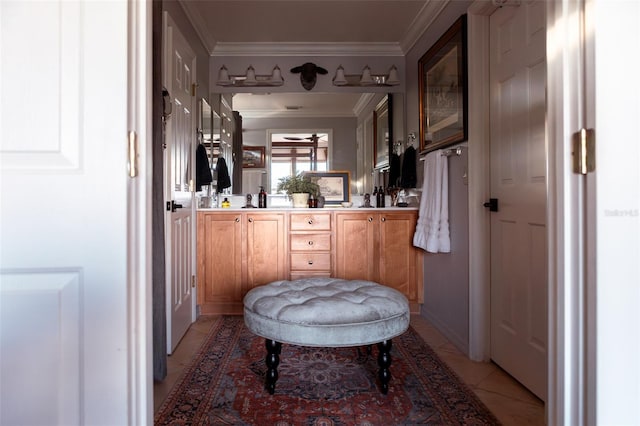 bathroom with tile patterned flooring, crown molding, and ceiling fan