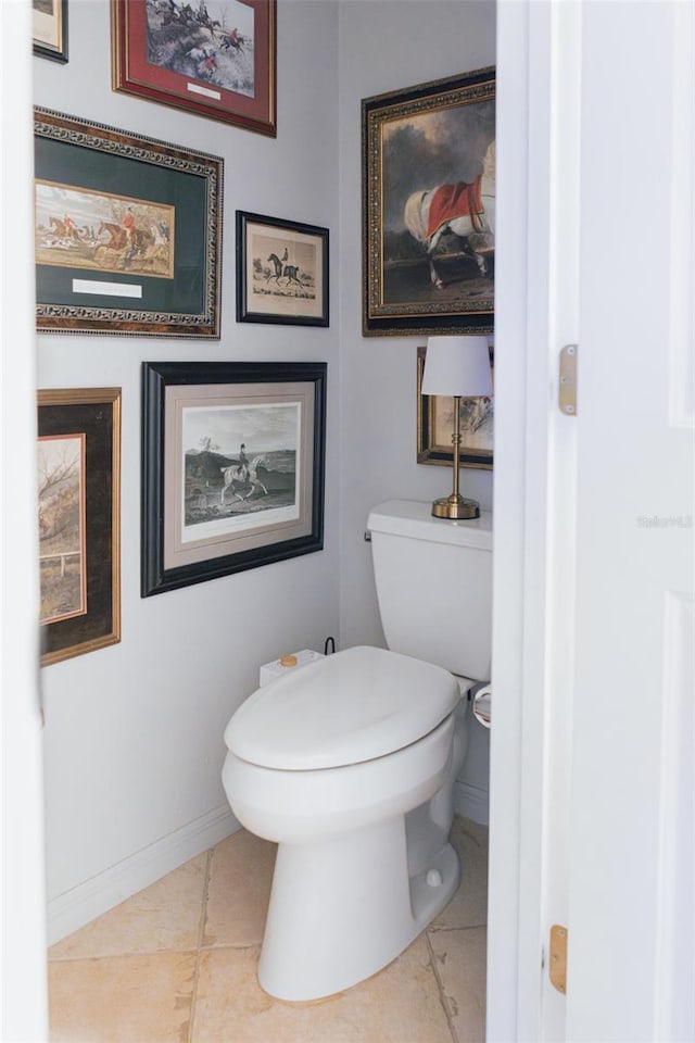 bathroom with tile patterned flooring and toilet