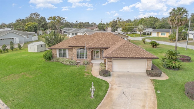 ranch-style house featuring a front lawn and a garage