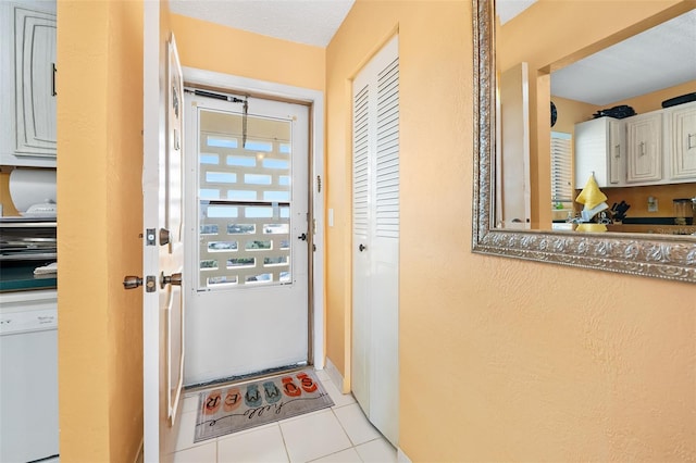 entryway featuring light tile patterned floors