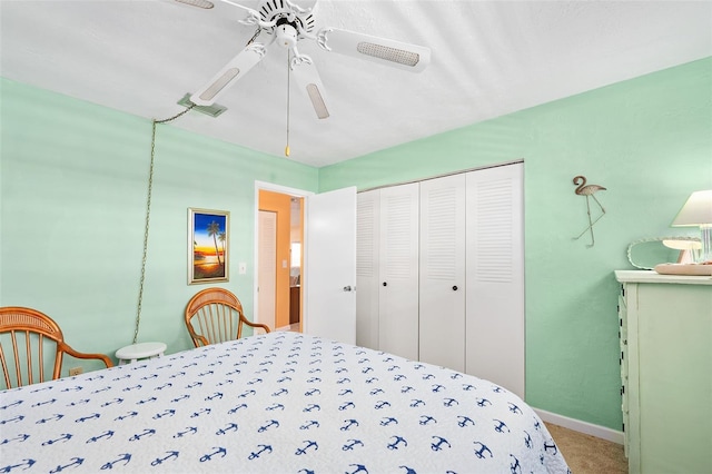 bedroom featuring carpet, a closet, and ceiling fan