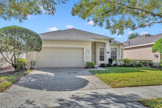 view of front facade featuring a garage and a front lawn