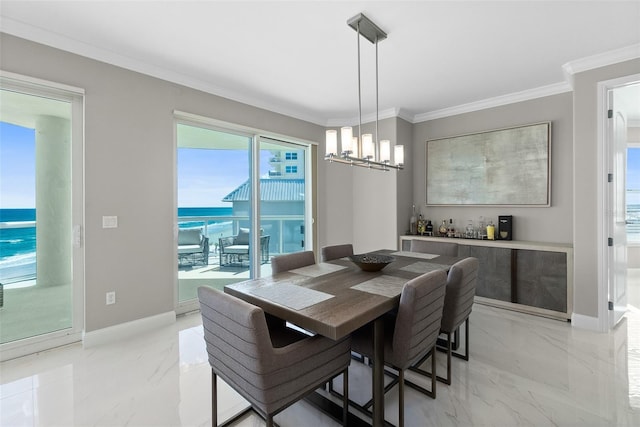 dining space with marble finish floor, baseboards, ornamental molding, and a notable chandelier