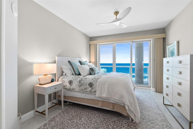 bedroom with access to exterior, ceiling fan, and baseboards