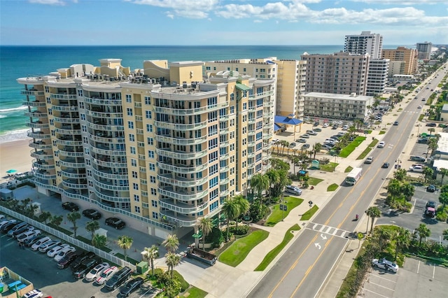 birds eye view of property featuring a water view and a view of city