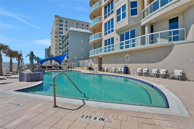 community pool featuring a patio area