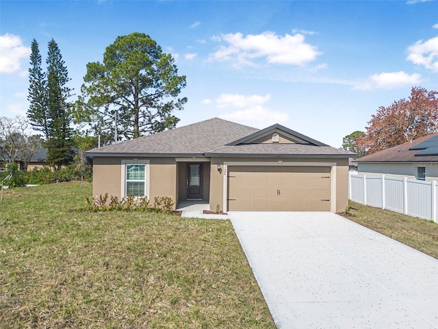 view of front facade featuring a garage and a front lawn