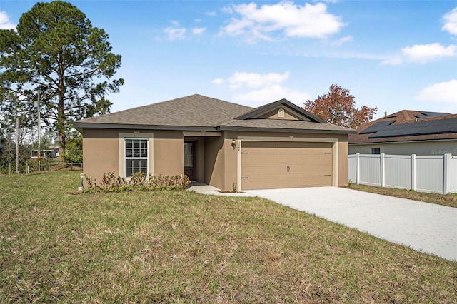 view of front of house featuring a front lawn and a garage