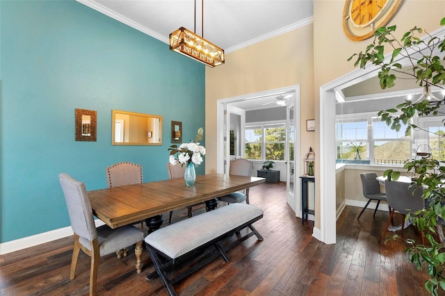 dining room featuring ceiling fan, crown molding, and dark hardwood / wood-style floors