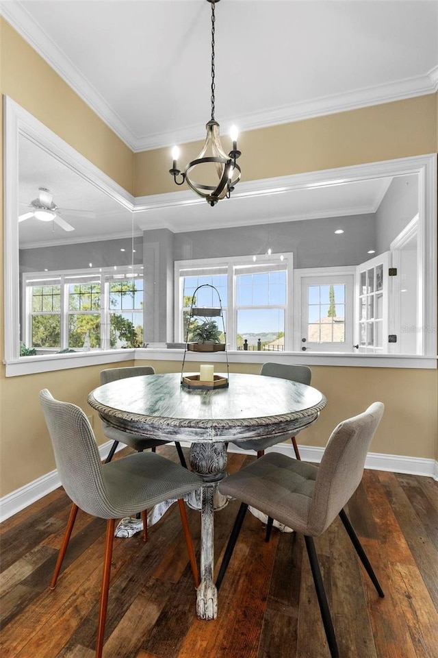 dining space featuring hardwood / wood-style floors, plenty of natural light, and ornamental molding