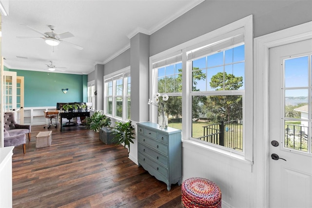 sunroom featuring ceiling fan