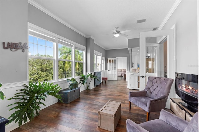 sunroom / solarium featuring ceiling fan