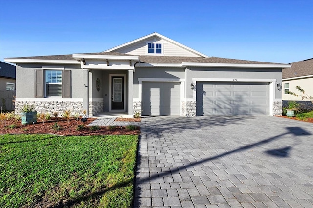 view of front of house with a front lawn and a garage