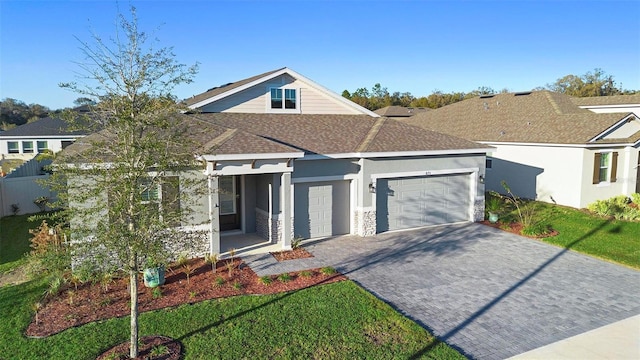 view of front of house featuring a front yard and a garage