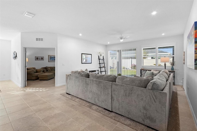 living room featuring ceiling fan and light tile patterned floors