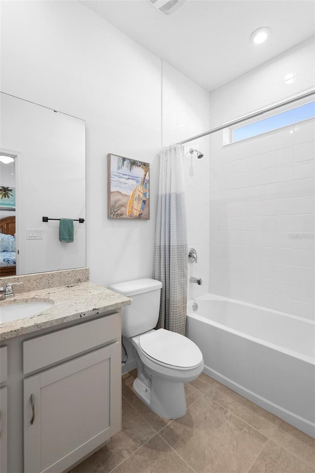 full bathroom featuring shower / tub combo with curtain, vanity, toilet, and tile patterned floors