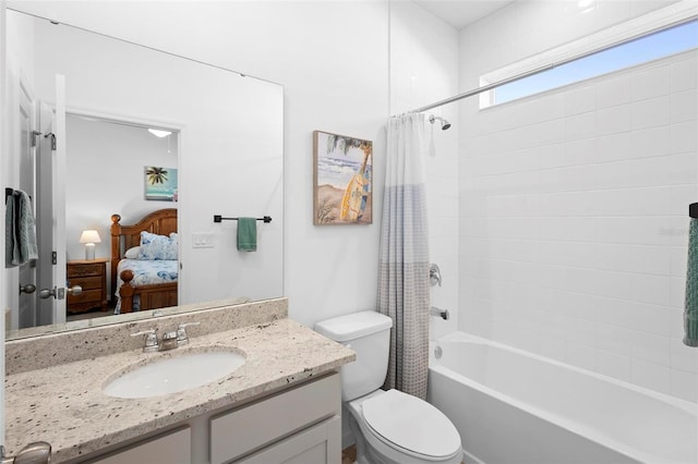 full bathroom with shower / tub combo with curtain, vanity, and toilet