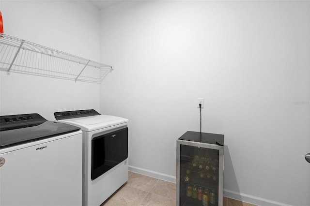 laundry room featuring wine cooler and washer and dryer