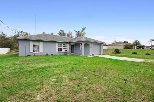 single story home with a garage, driveway, fence, a front yard, and stucco siding