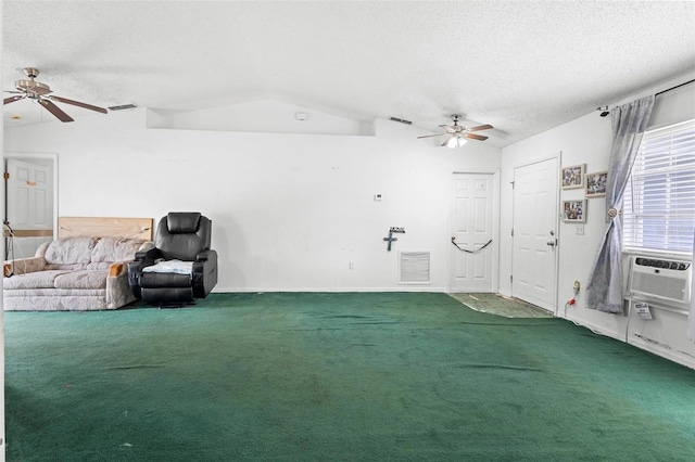 interior space featuring lofted ceiling, a textured ceiling, carpet, and visible vents