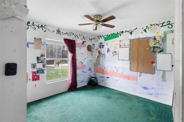 empty room with a textured ceiling, ceiling fan, and carpet flooring