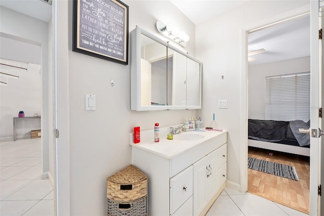 bathroom featuring tile patterned flooring and vanity