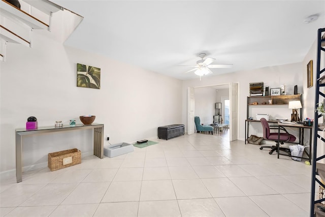 tiled home office featuring ceiling fan