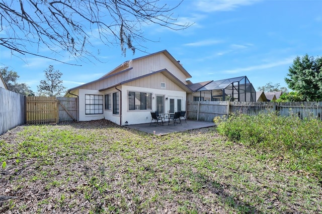 back of property with a patio