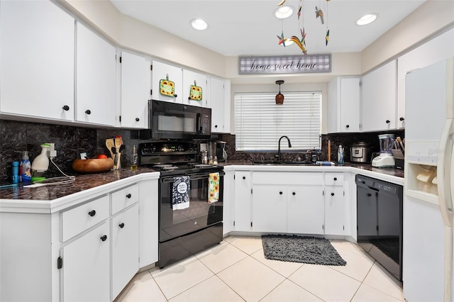 kitchen featuring white cabinets, light tile patterned floors, sink, and black appliances