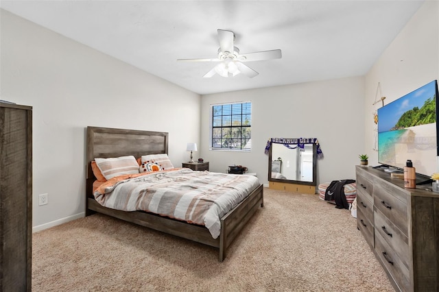 bedroom with light carpet and ceiling fan