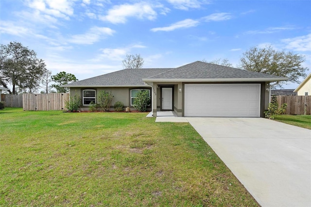 ranch-style house featuring a front lawn and a garage