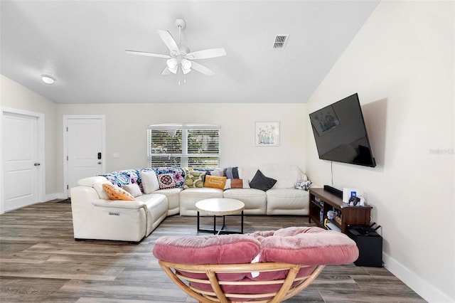 living room featuring hardwood / wood-style flooring, lofted ceiling, and ceiling fan