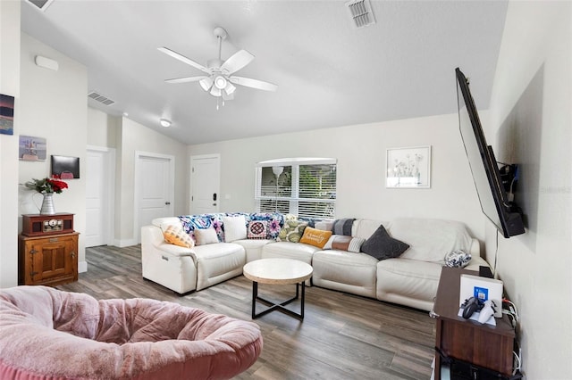 living room with hardwood / wood-style flooring, ceiling fan, and vaulted ceiling