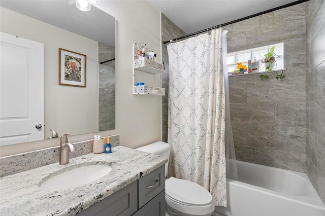 full bathroom with toilet, vanity, shower / tub combo, and a textured ceiling