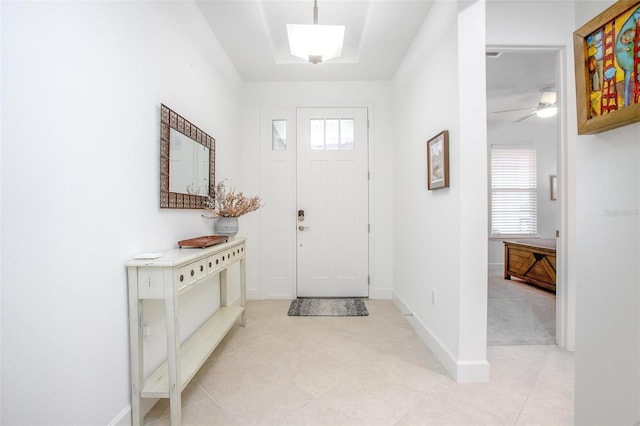 entryway with a healthy amount of sunlight and baseboards