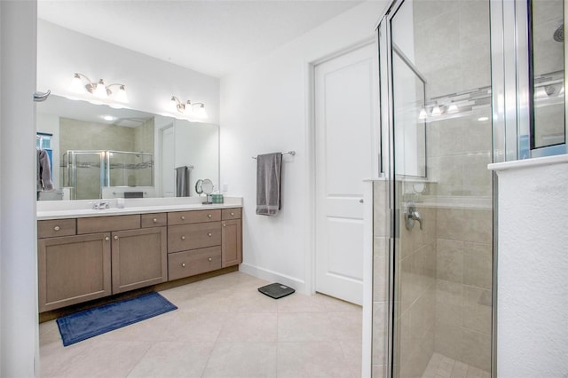 full bathroom featuring a stall shower, tile patterned flooring, baseboards, and vanity