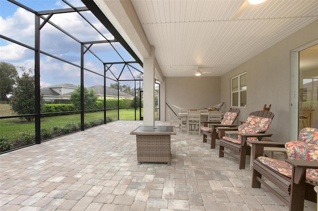 view of patio / terrace featuring glass enclosure and an outdoor hangout area