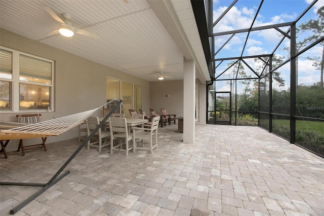 sunroom with a ceiling fan