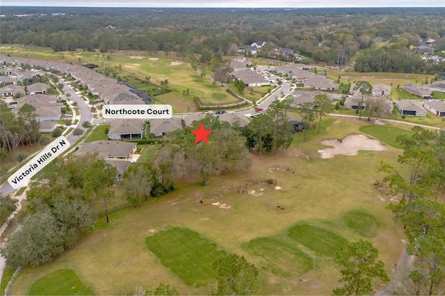 drone / aerial view featuring a residential view and golf course view