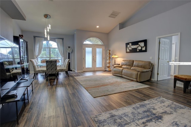 living area with recessed lighting, visible vents, baseboards, french doors, and dark wood finished floors