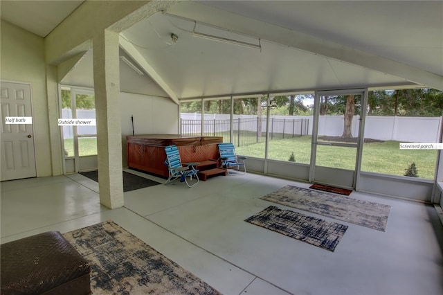 sunroom featuring vaulted ceiling