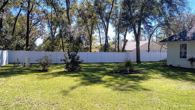 view of yard with a fenced backyard