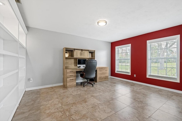 office space with baseboards