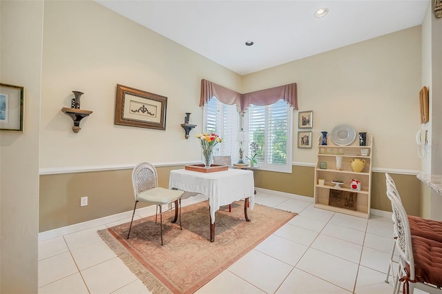 sitting room featuring light tile patterned floors, recessed lighting, and baseboards