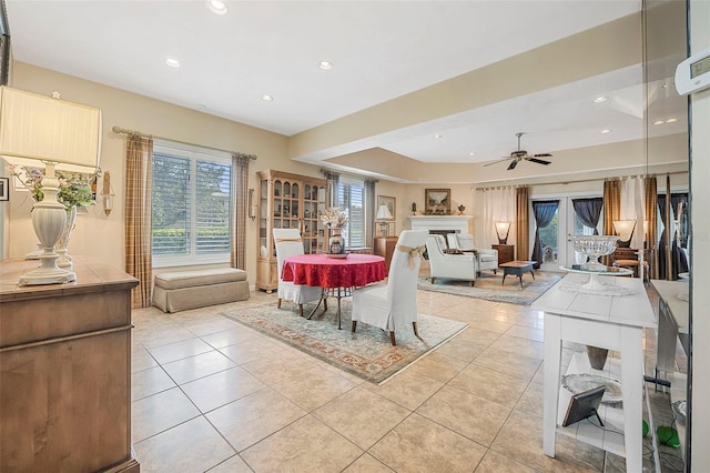 dining area with a ceiling fan, recessed lighting, a fireplace, and light tile patterned floors